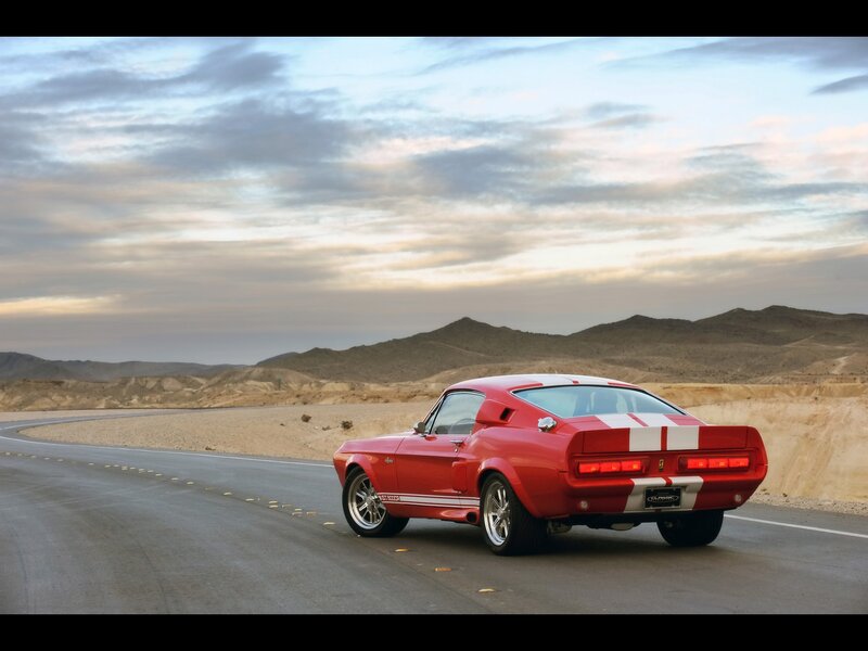 Red muscle car on desert road