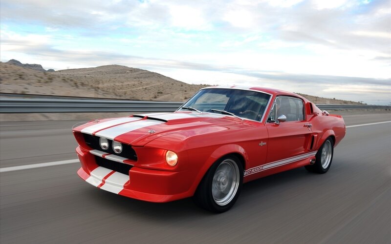 red muscle car on highway