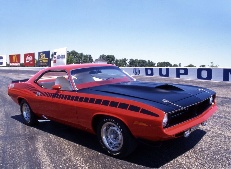 Red muscle car on racetrack