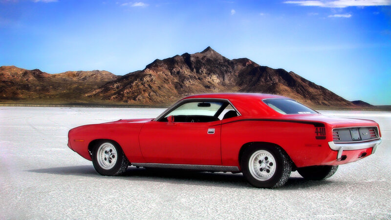 Red muscle car on salt flat