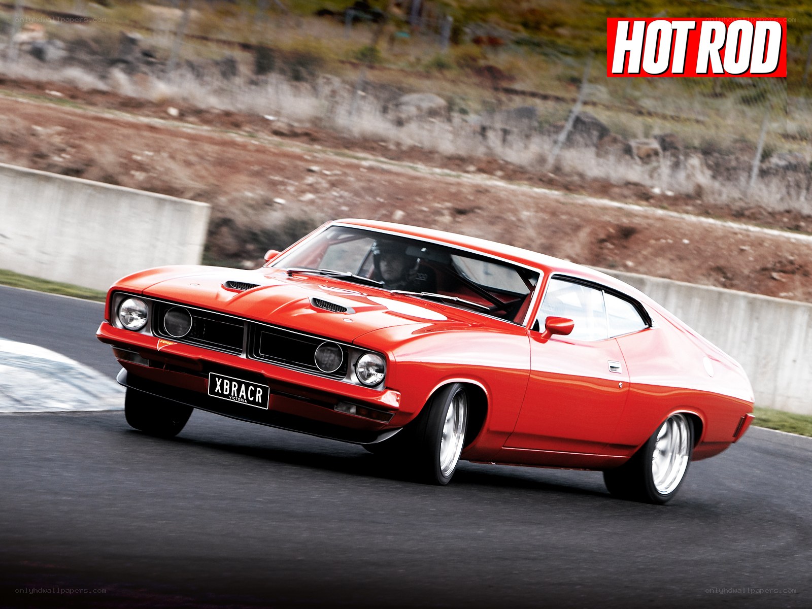 Red muscle car on track