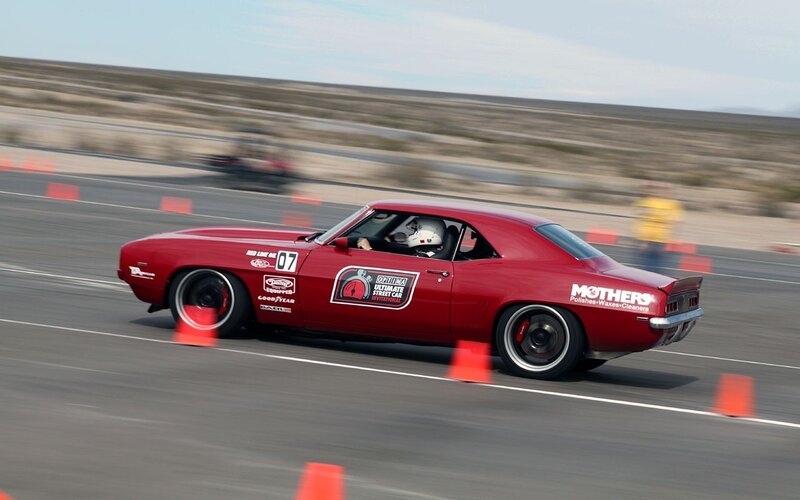 Red muscle car racing
