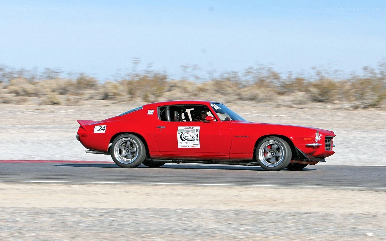 Red muscle car racing