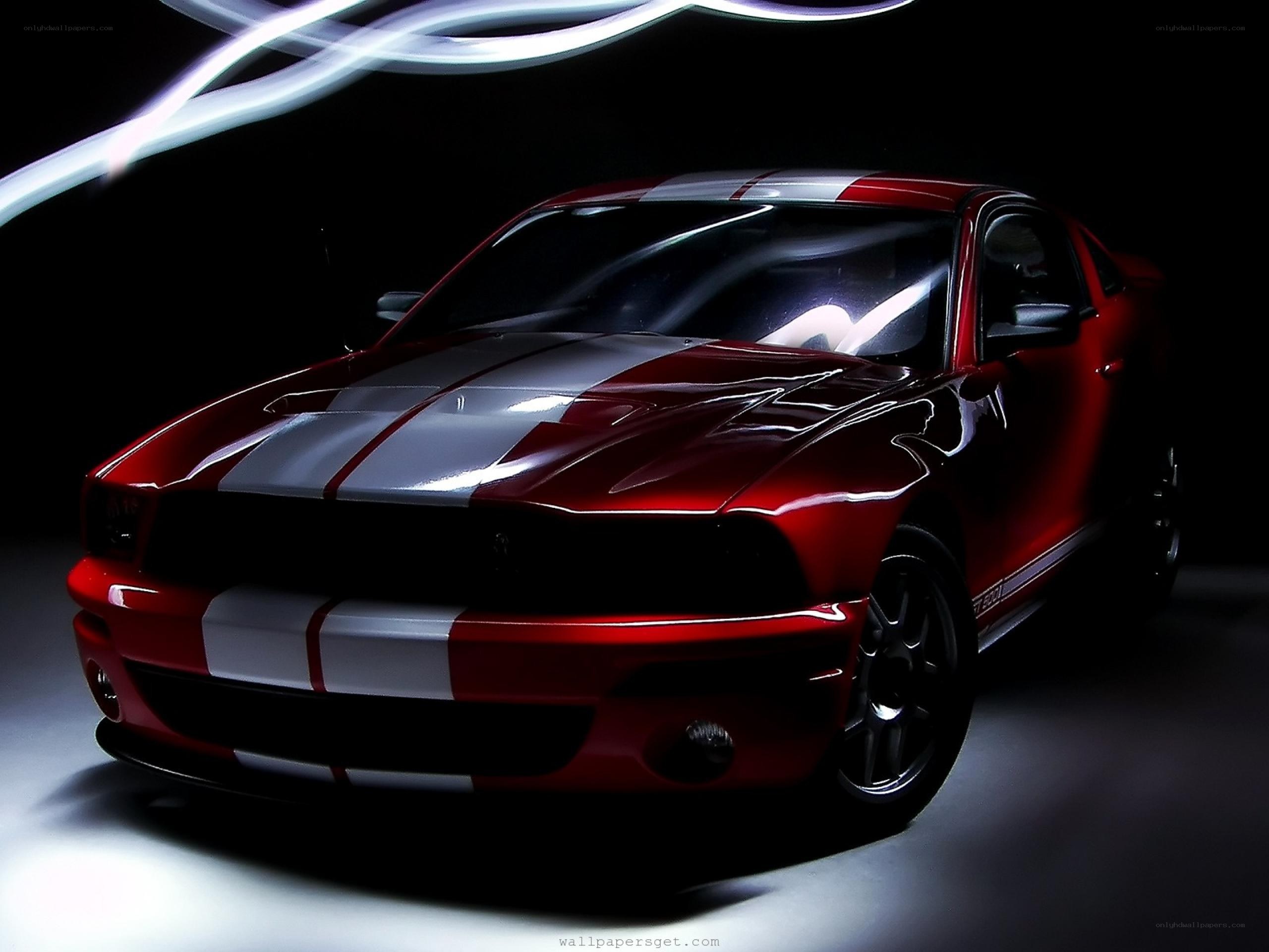 red muscle car with stripes