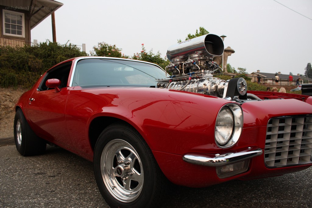 red muscle car with supercharger