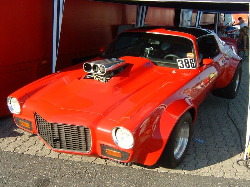 Red muscle car with supercharger