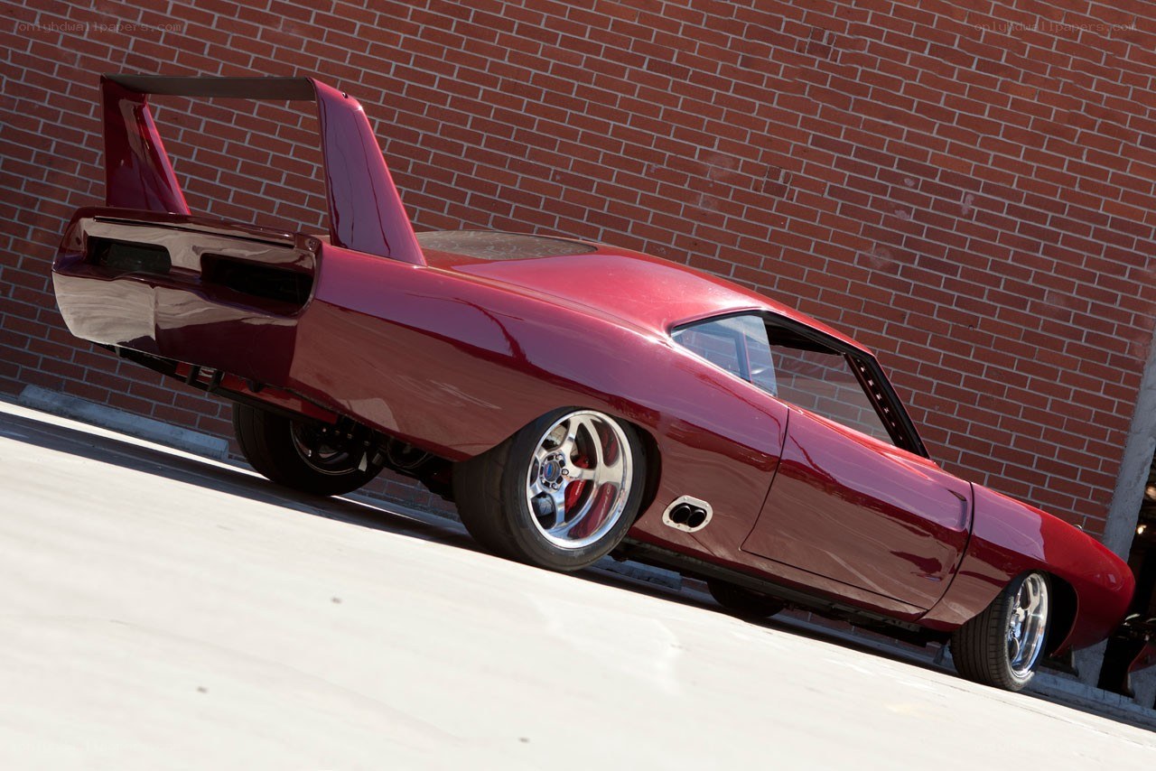 red muscle car with wing