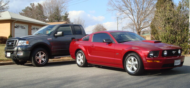 Red Mustang and black Ford F-150