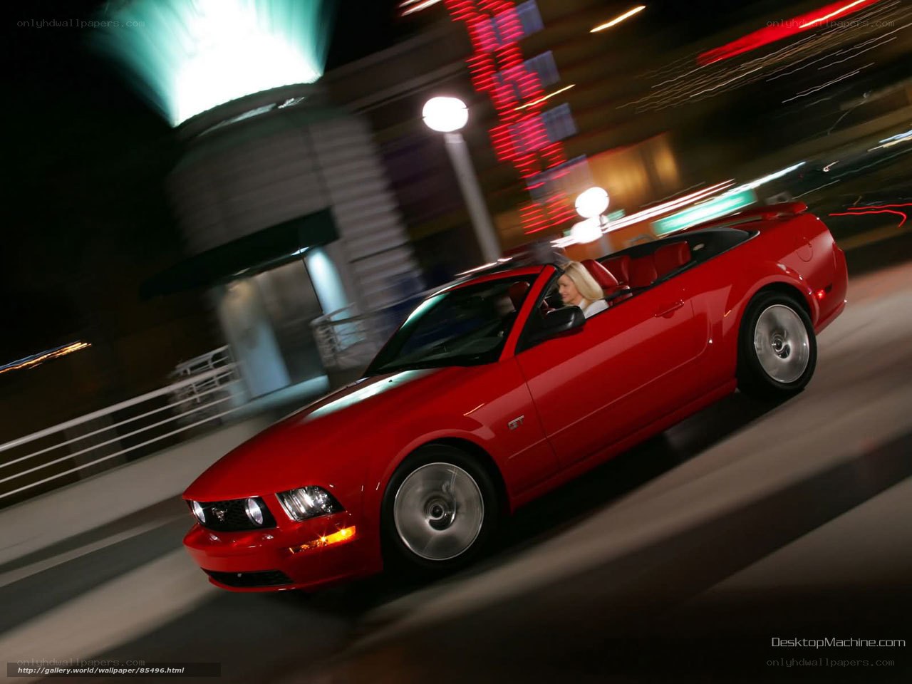 Red Mustang convertible at night