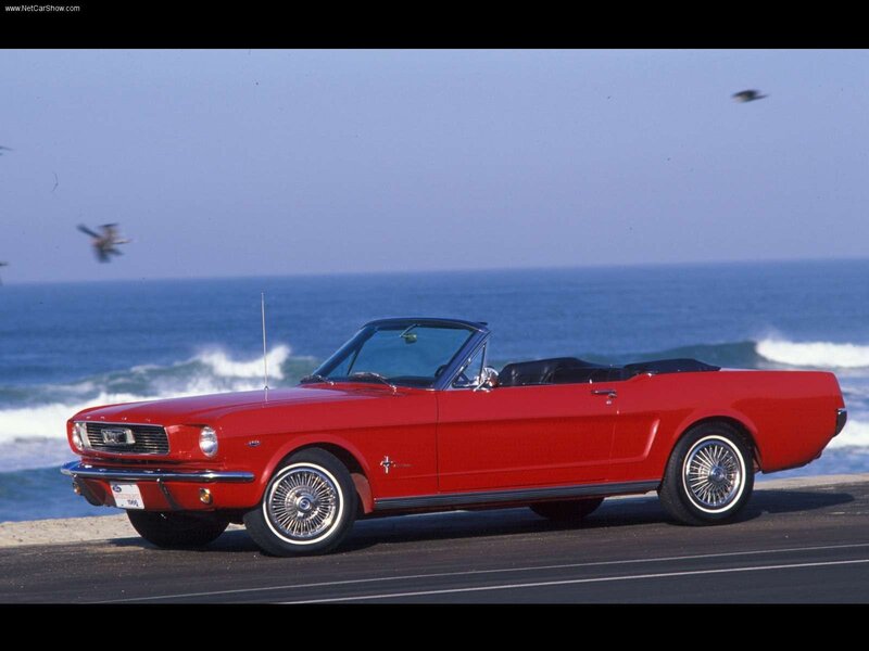 Red Mustang convertible by the sea