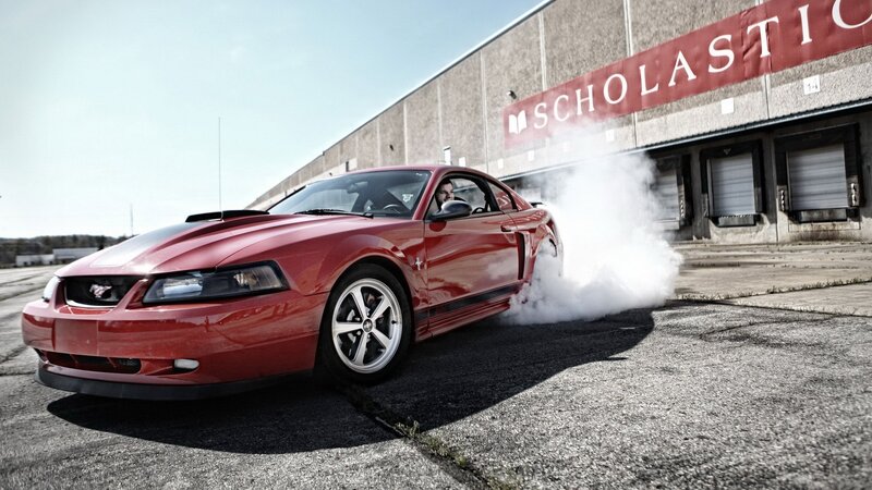 Red Mustang doing a burnout
