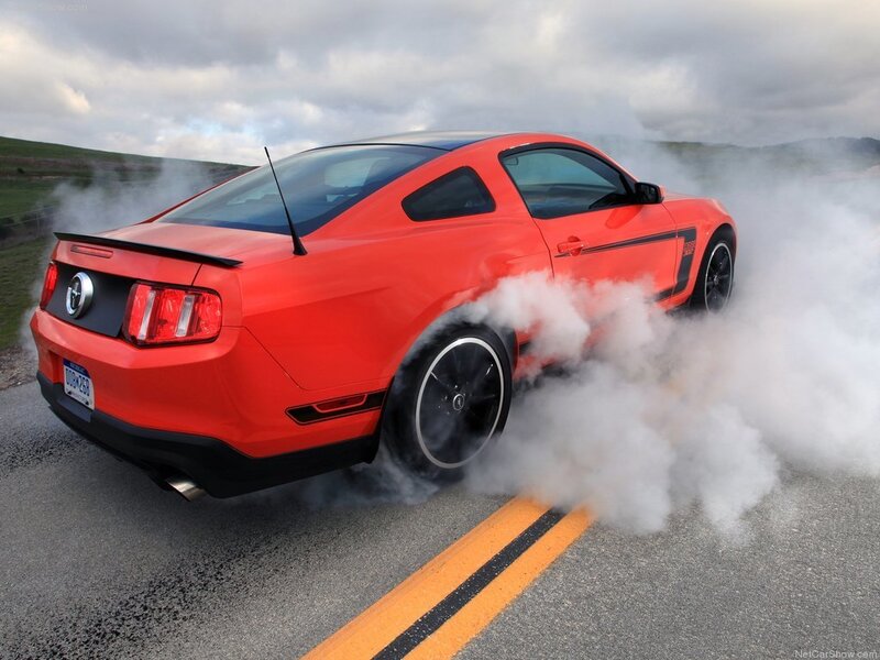 red mustang doing burnout