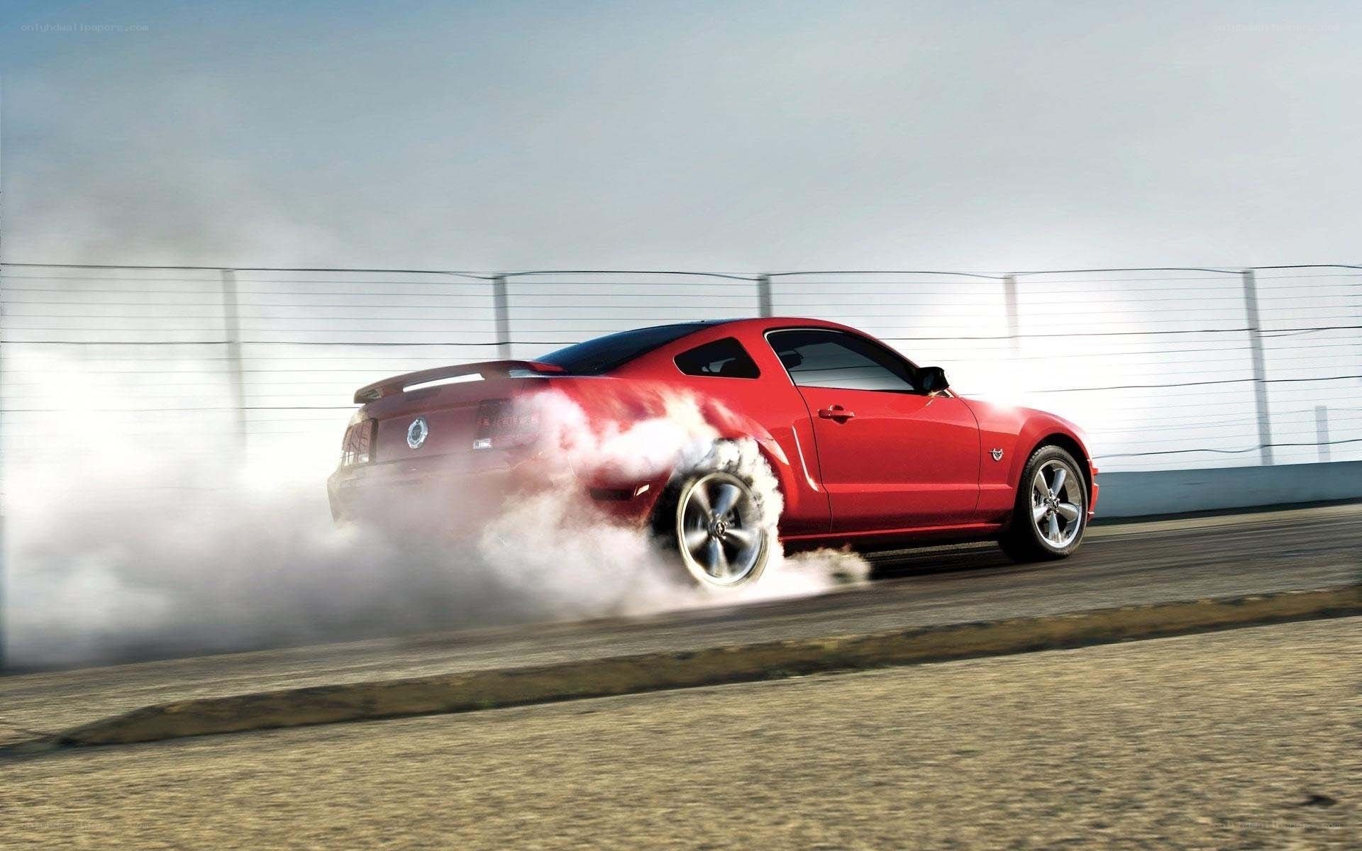 Red Mustang doing burnout