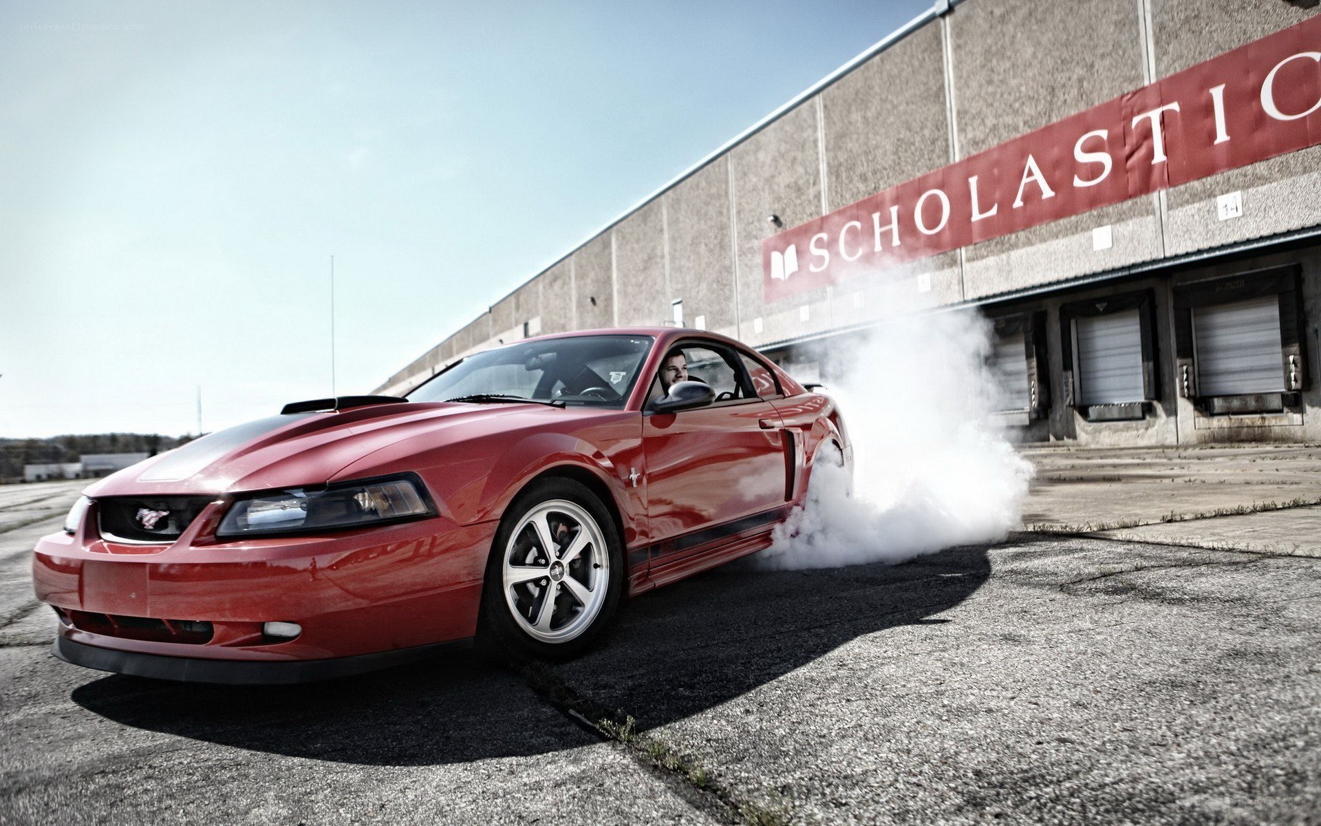 Red Mustang doing burnout
