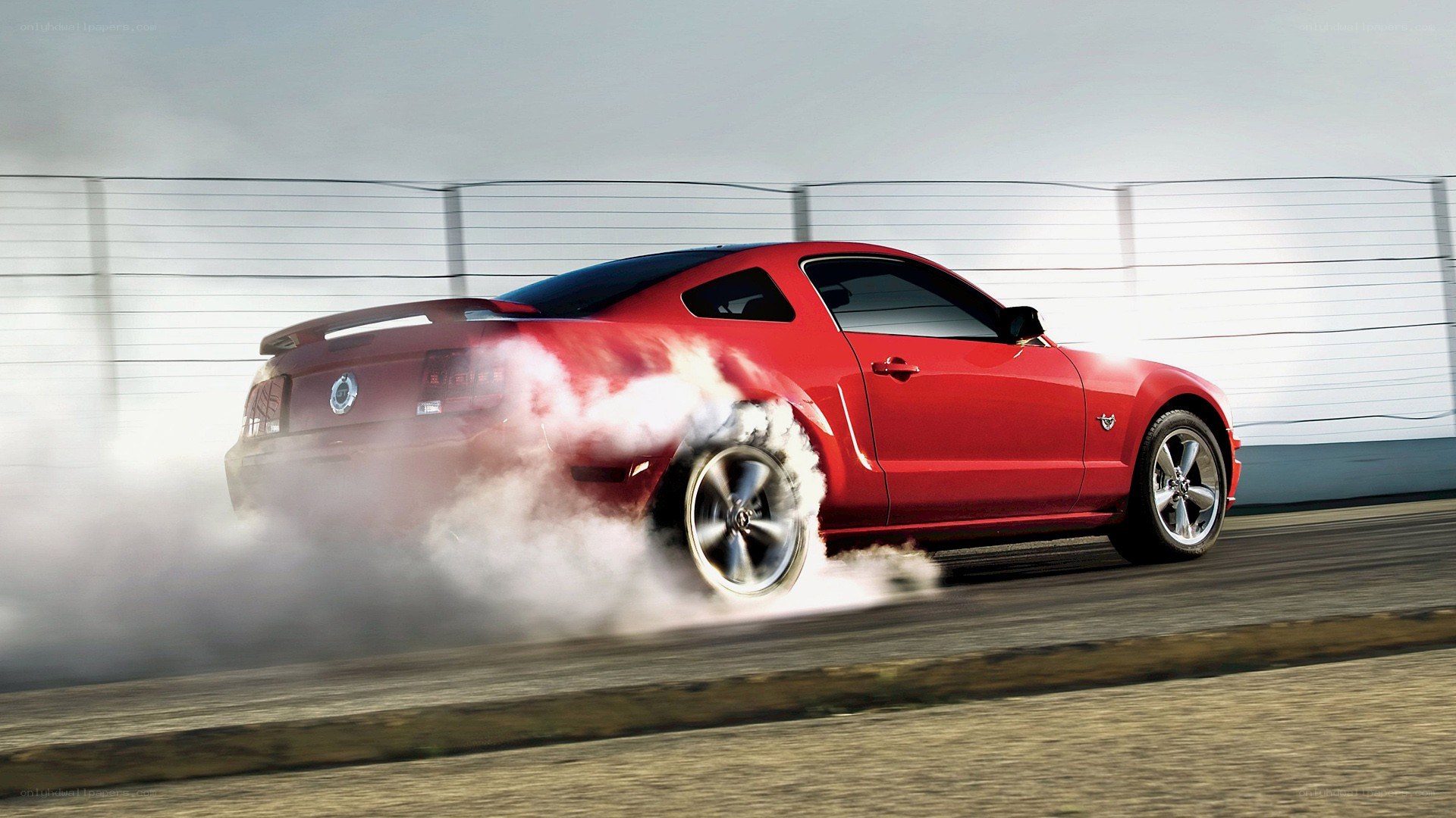 red mustang doing burnout