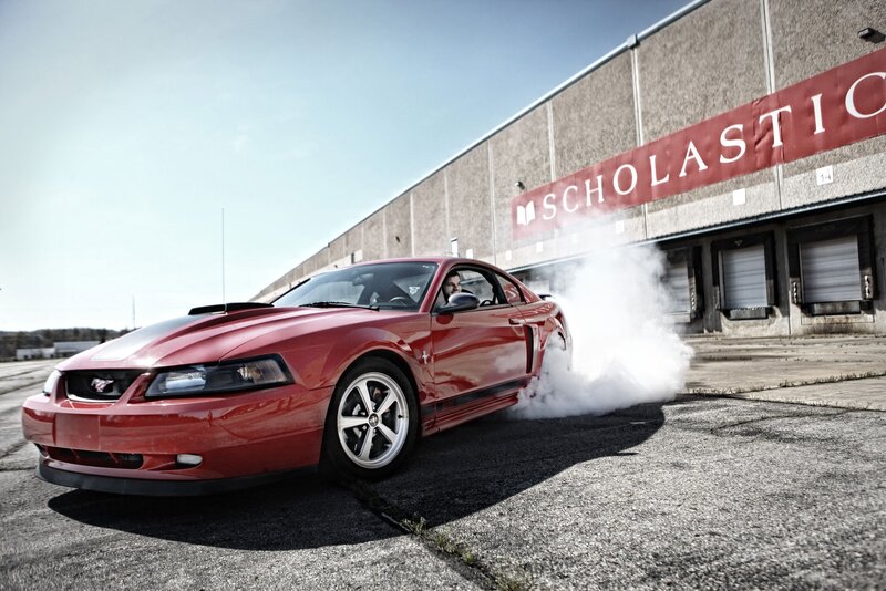 Red Mustang doing burnout