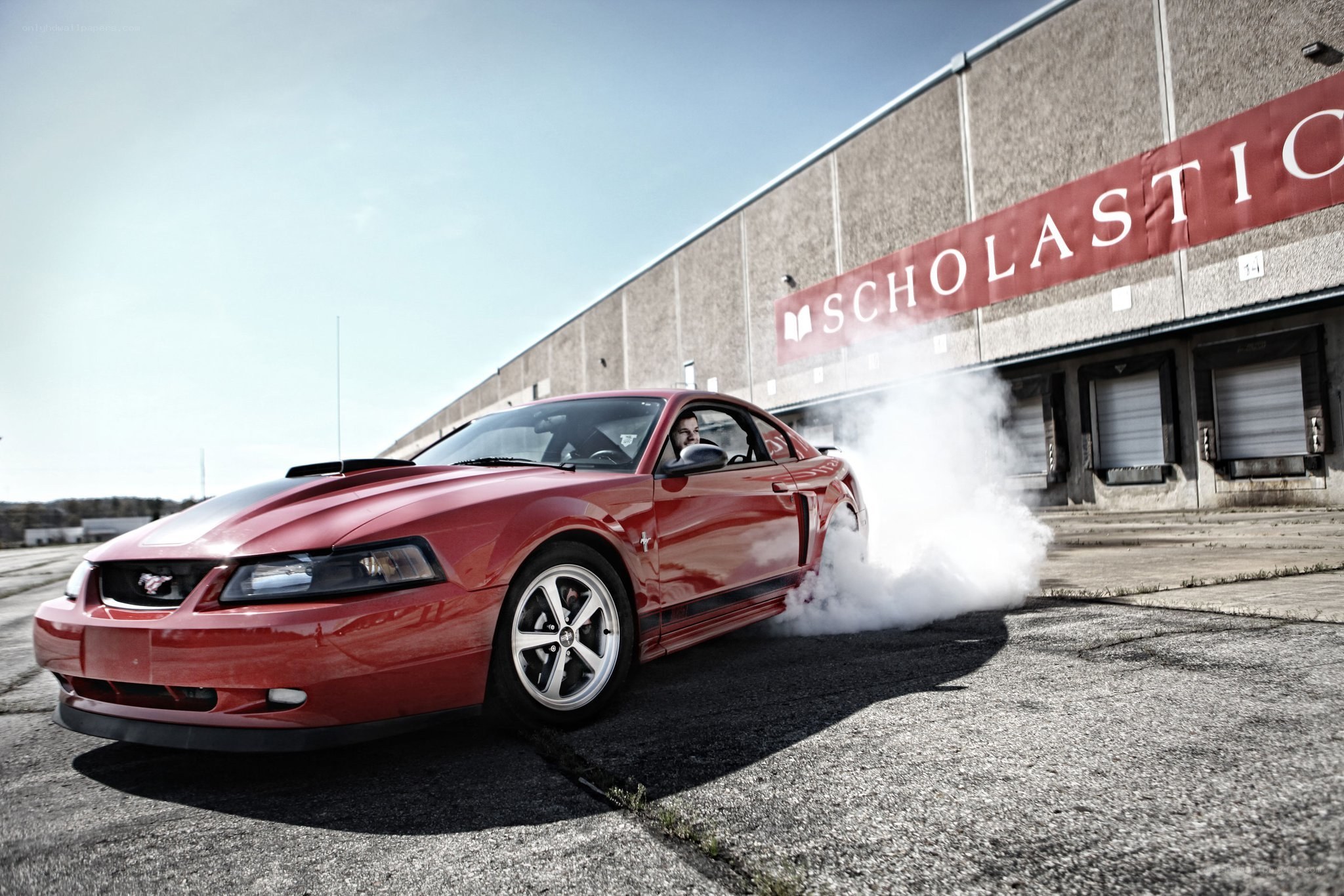 Red Mustang doing burnout