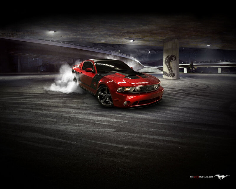 Red Mustang drifting at night