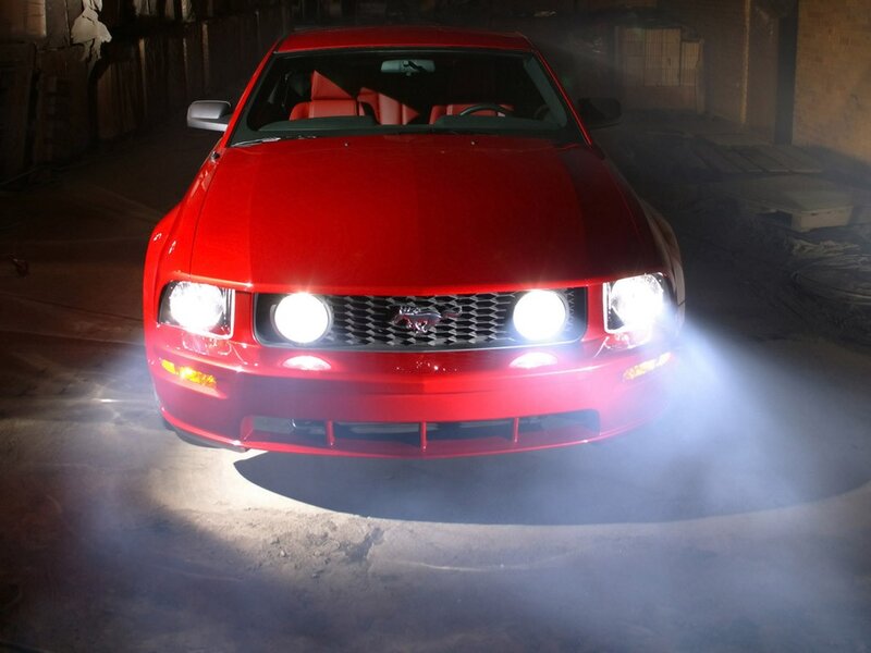 Red Mustang in a dimly lit garage
