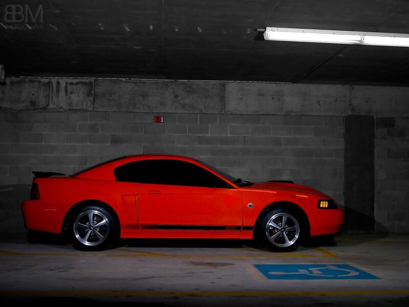 Red Mustang in parking garage
