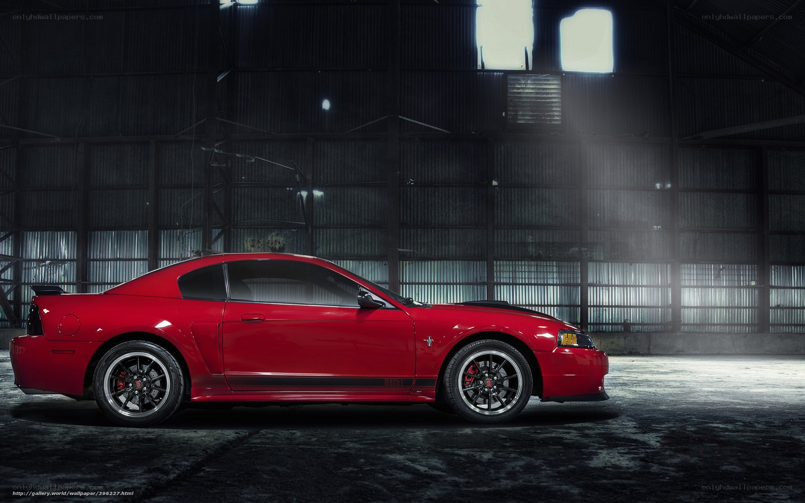 Red Mustang in warehouse