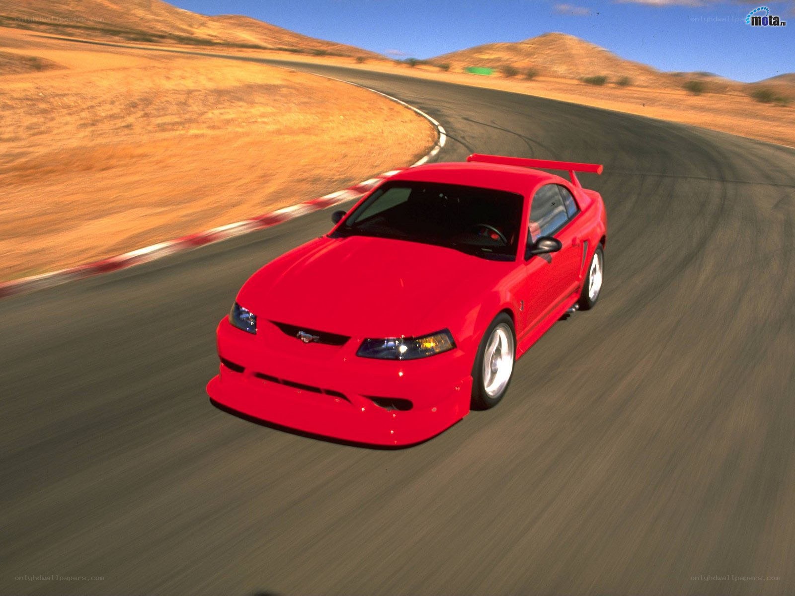 Red Mustang on a racetrack