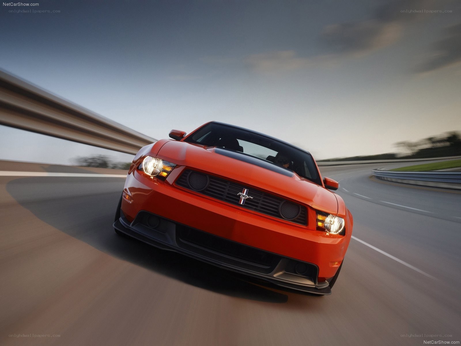 red mustang on a racetrack