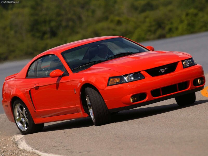 red mustang on a road