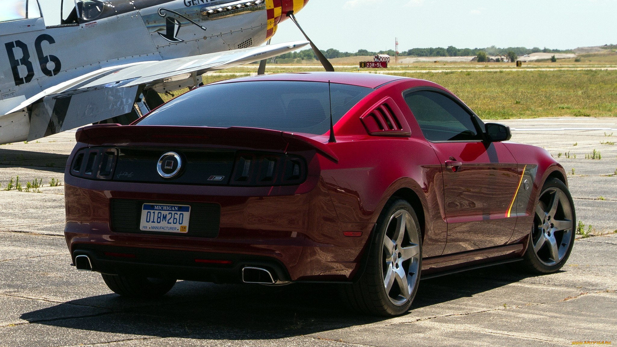 Red Mustang on airfield