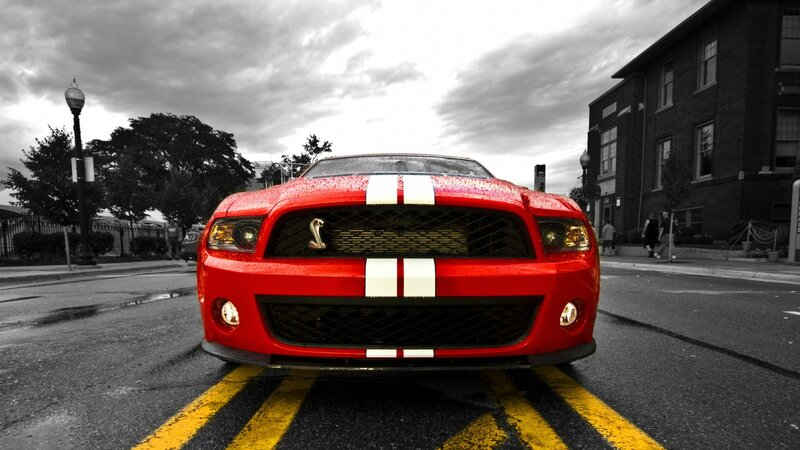 red mustang on city street
