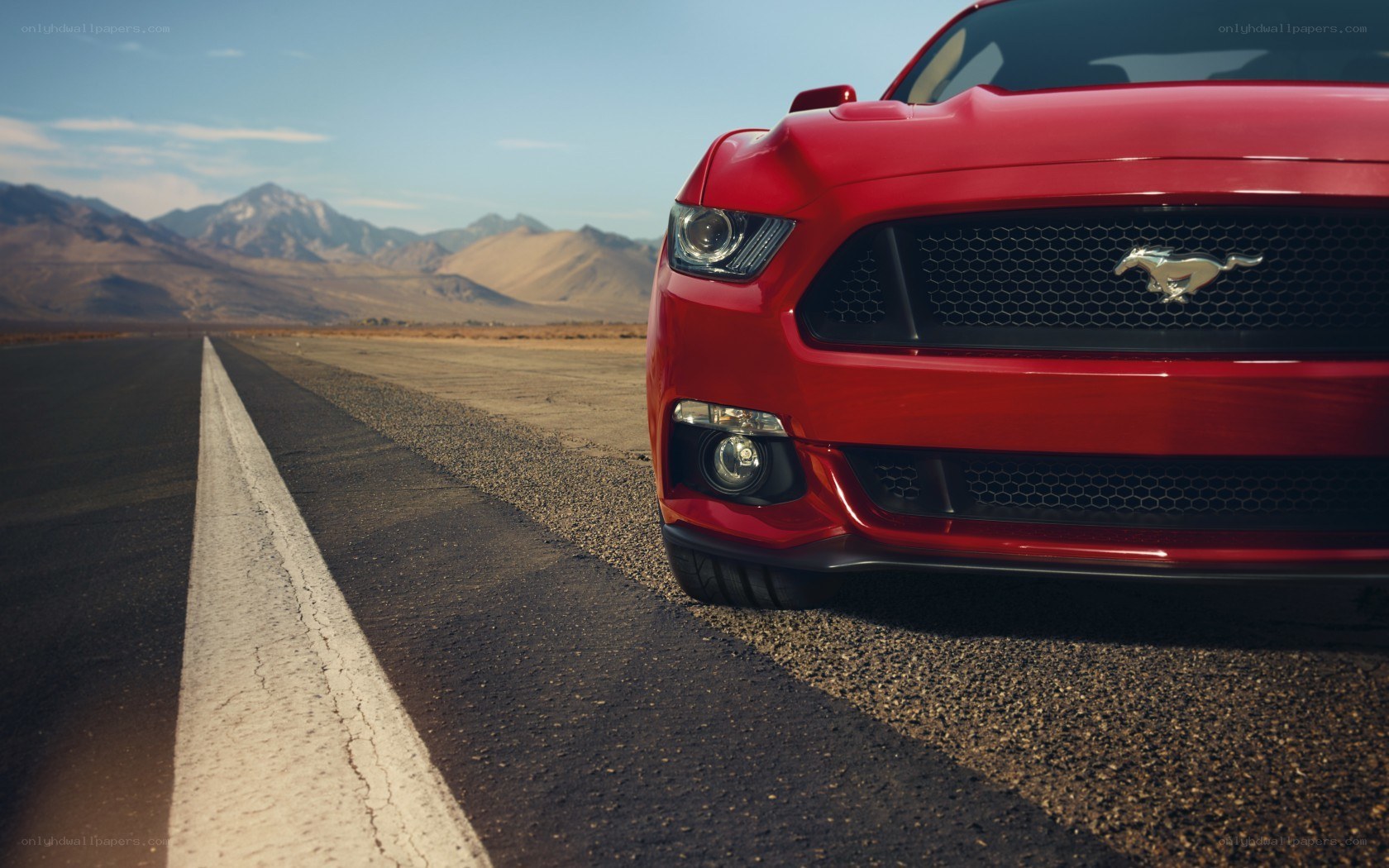 Red Mustang on desert road