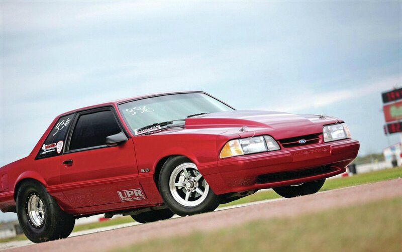 Red Mustang on Racetrack — Dynamic