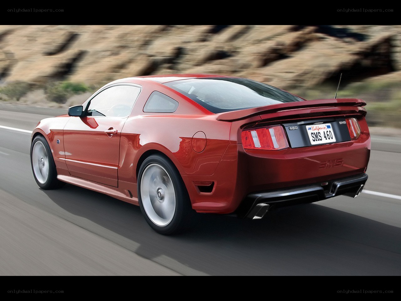 red mustang on road
