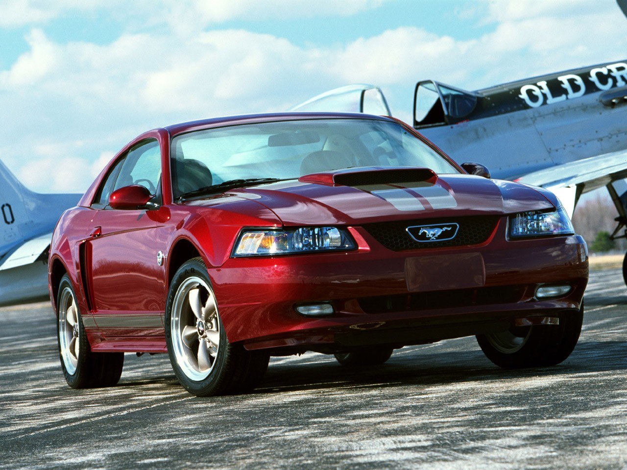 Red Mustang on tarmac
