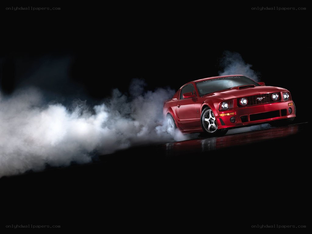Red Mustang performing burnout