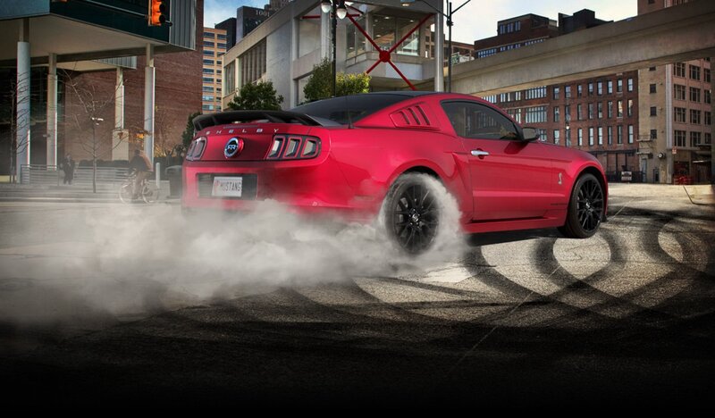 Red Mustang Shelby doing burnout