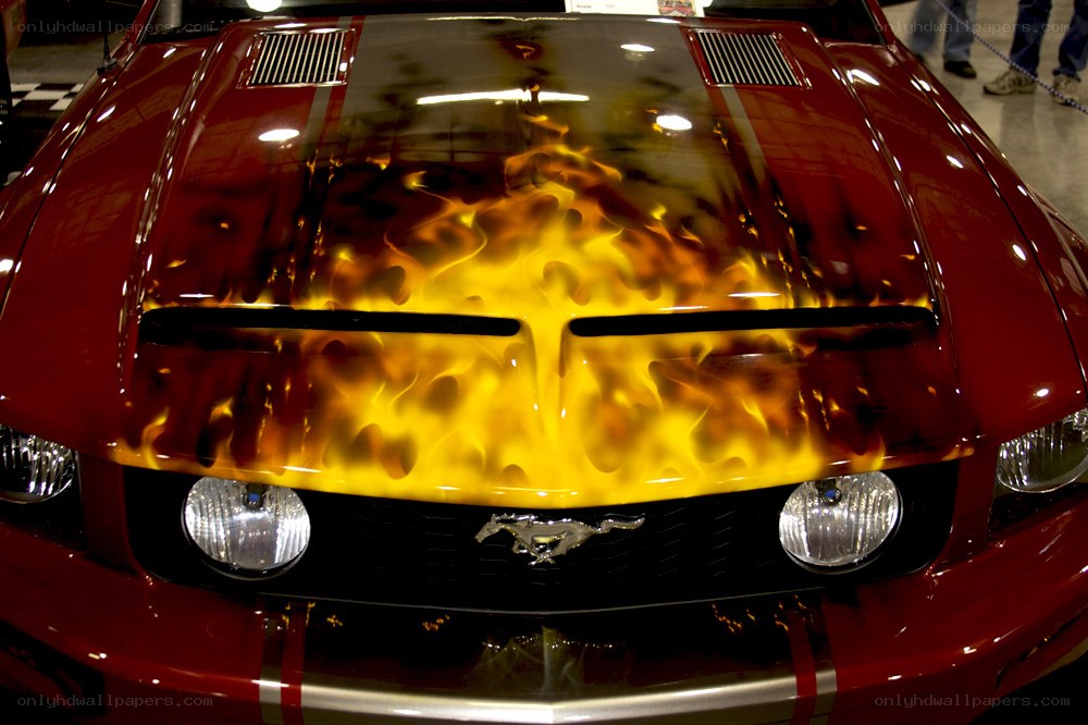 red mustang with flame design