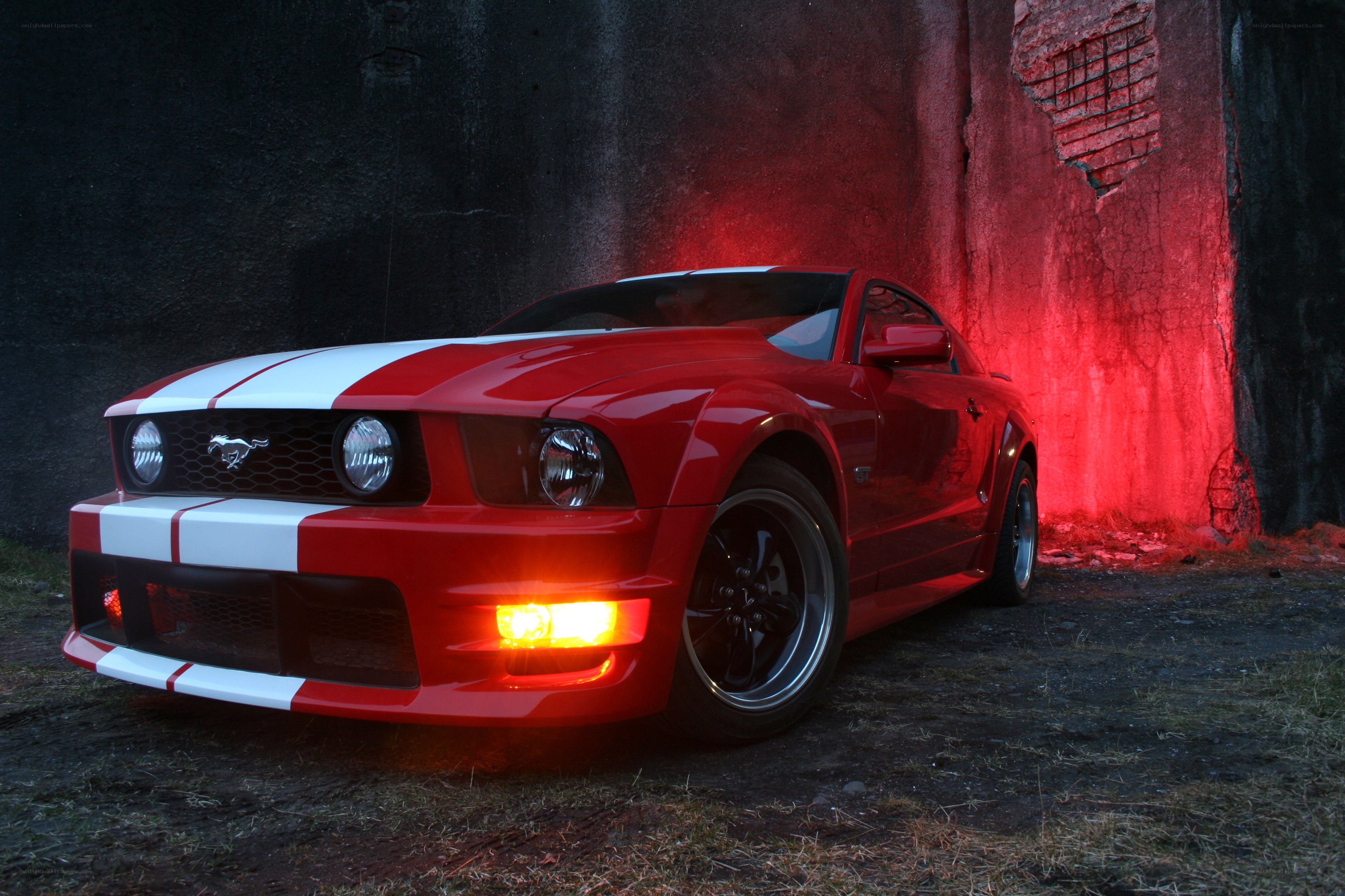 Red Mustang with racing stripes