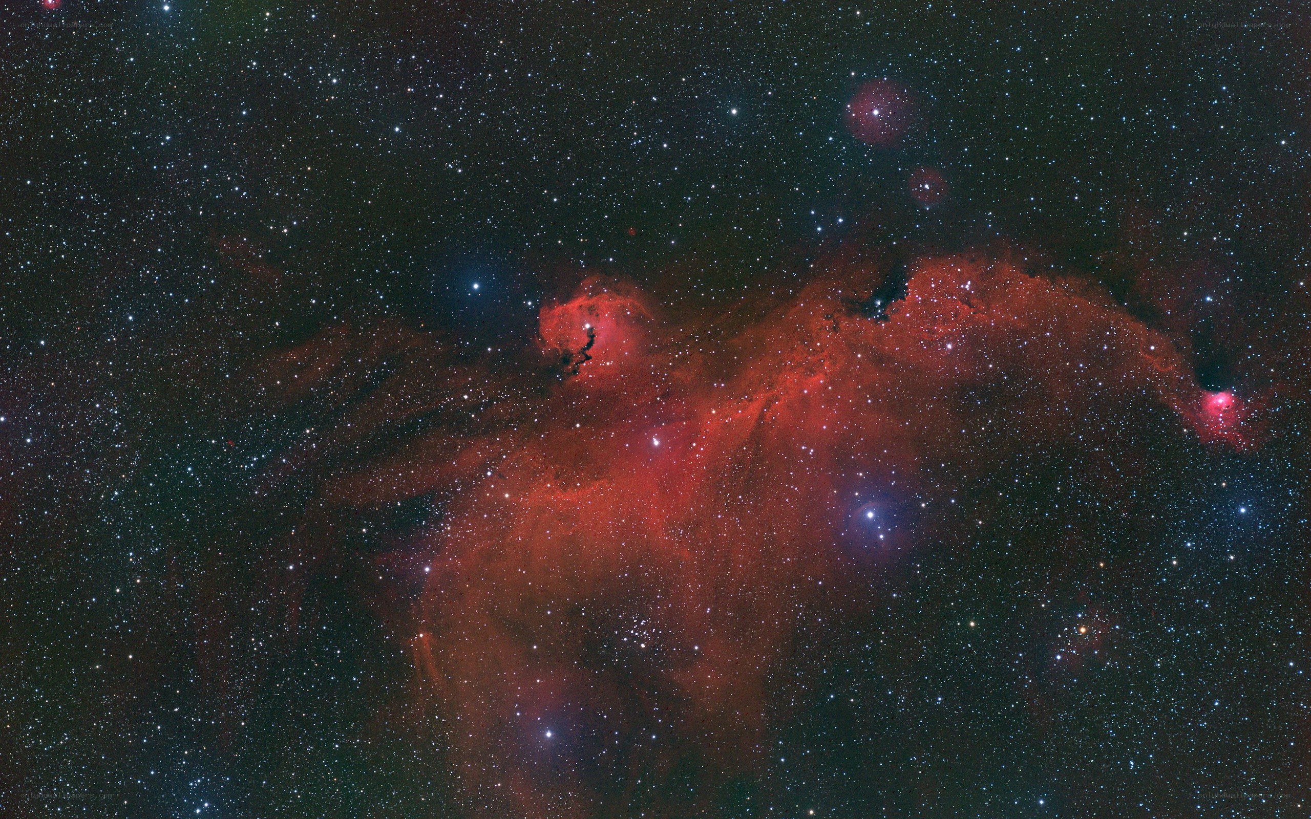 Red nebula in star field