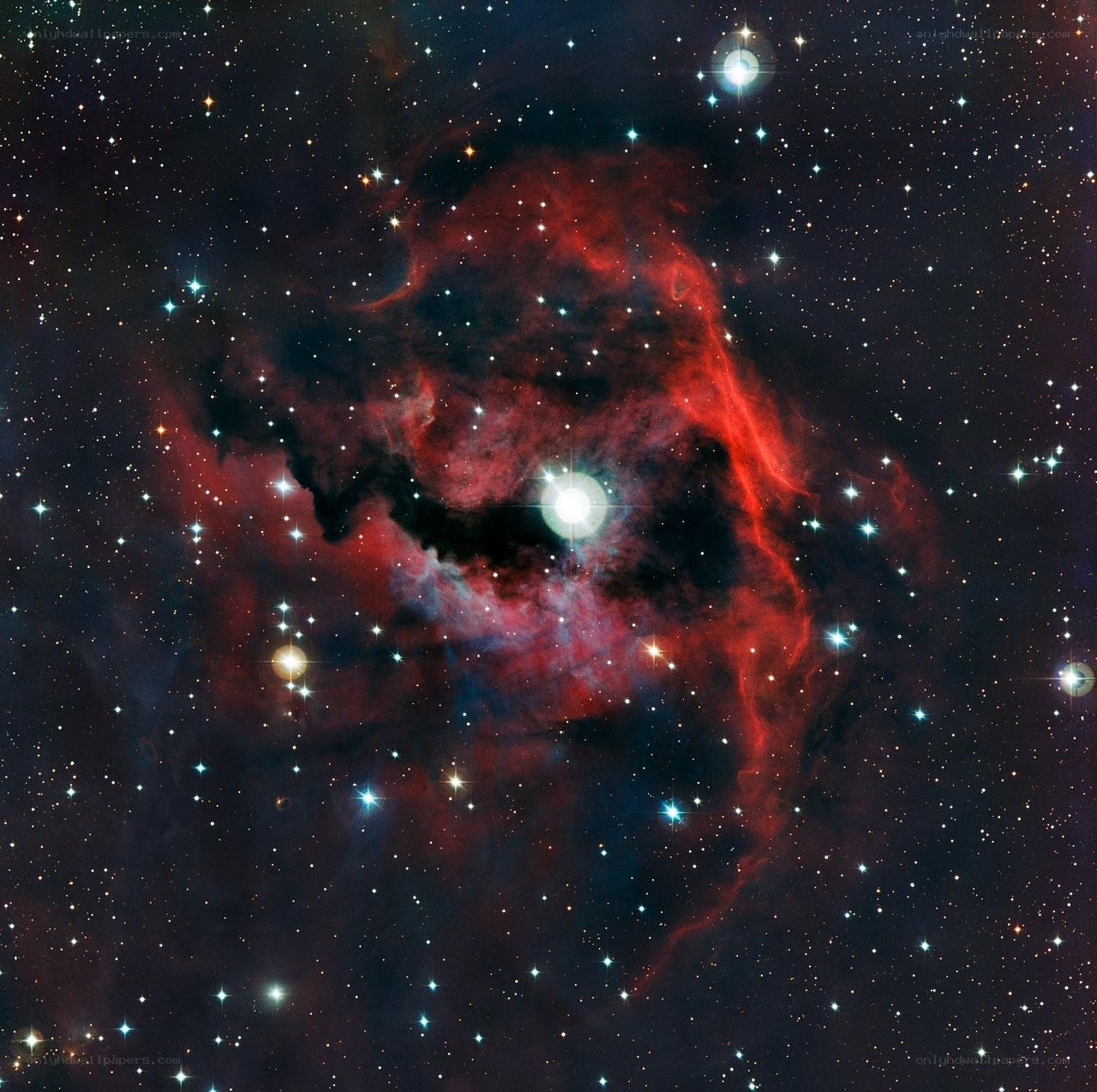 Red nebula in star field