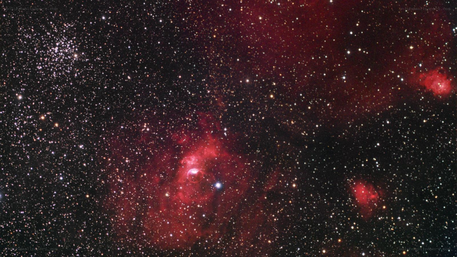 Red nebula in star field