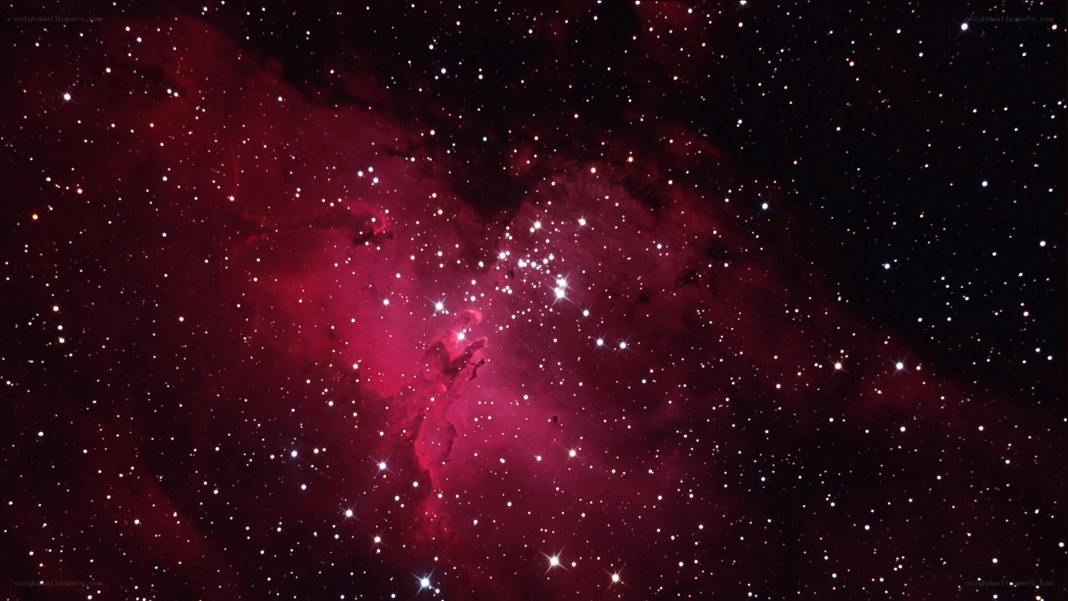 Red nebula in star field