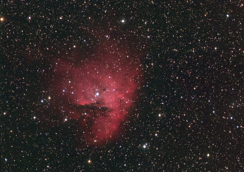 Red nebula in star field