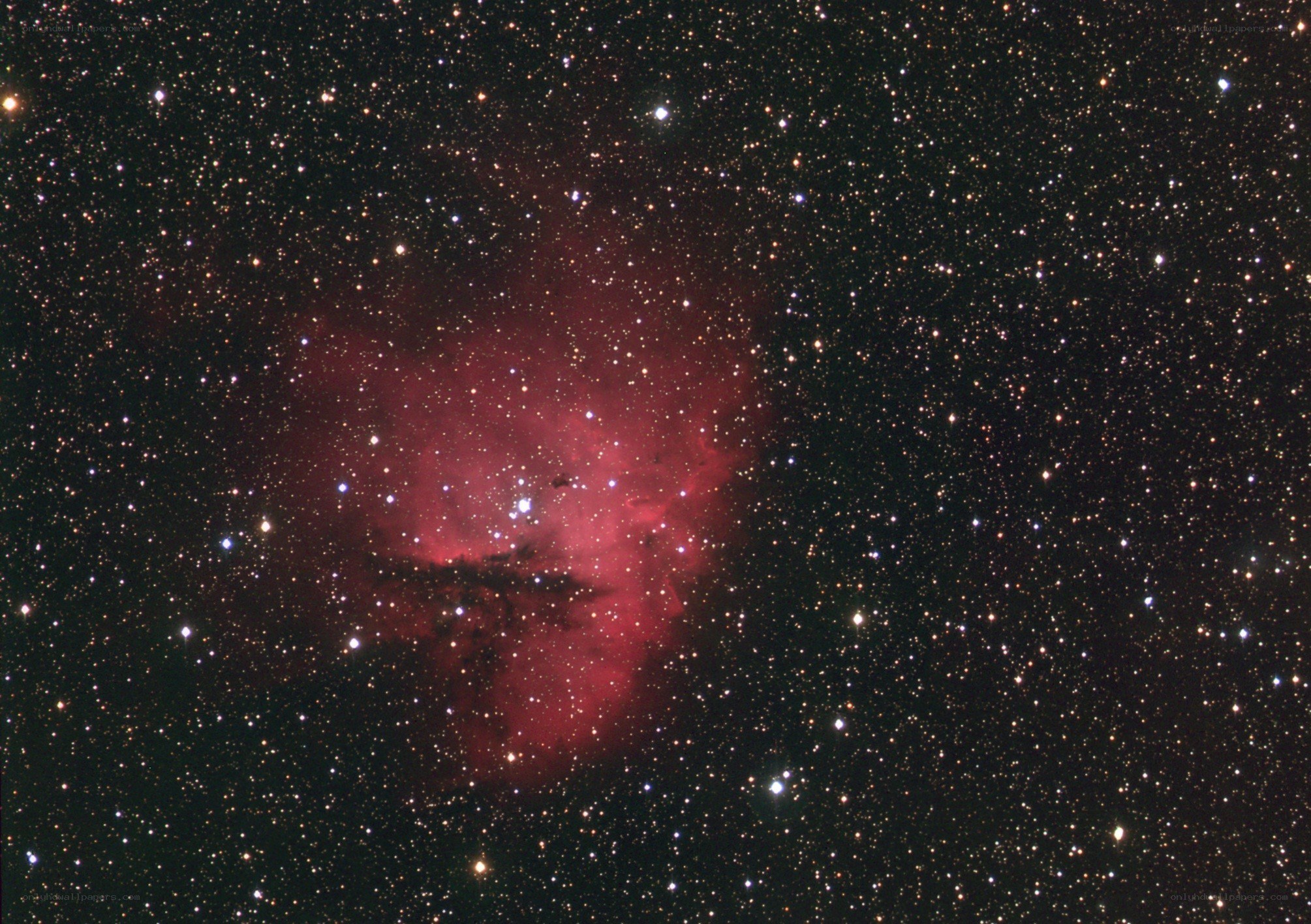Red nebula in star field