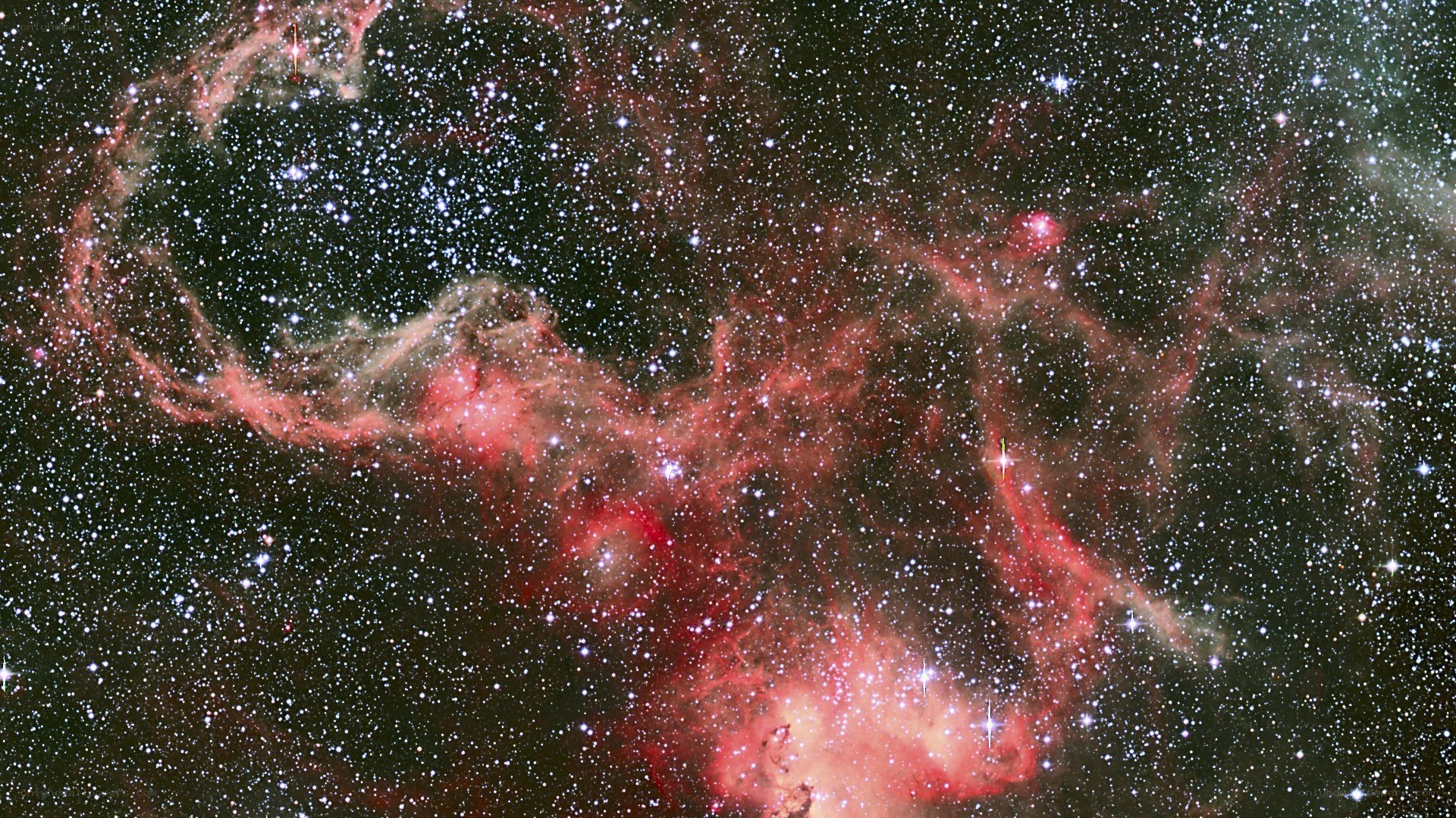 Red nebula in star field