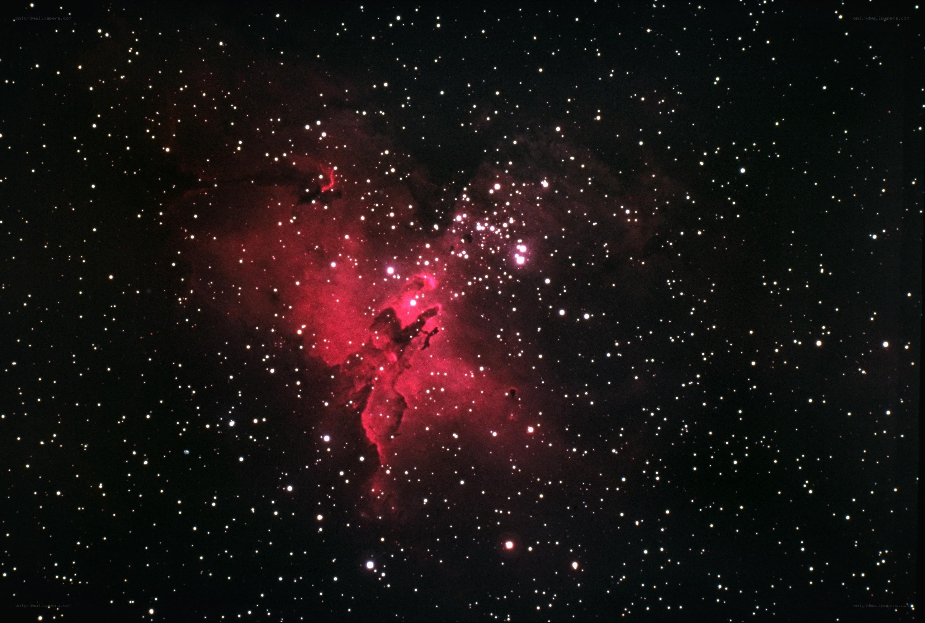 Red nebula in star field
