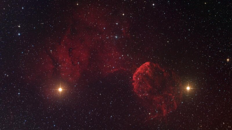 Red nebula in starfield