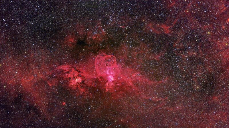 Red nebula in starfield