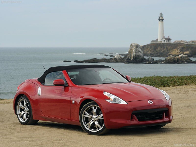 Red Nissan 370Z convertible by the coast