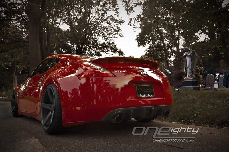 Red Nissan 370Z in a cemetery